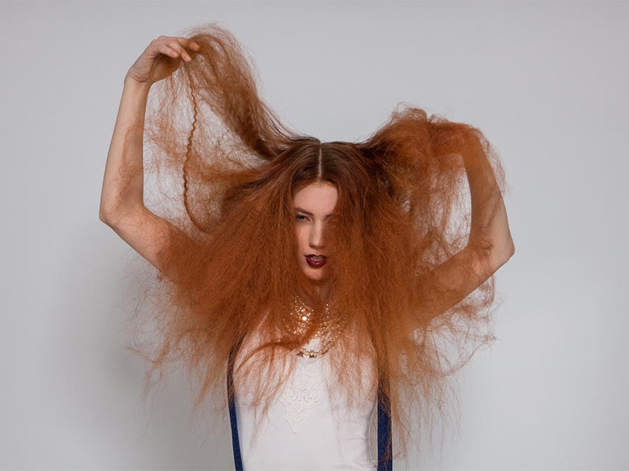 Woman with red frizzy hair in Ireland Fashion.ie