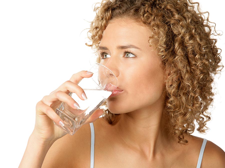 woman drinking glass of water Fashion.ie 2023